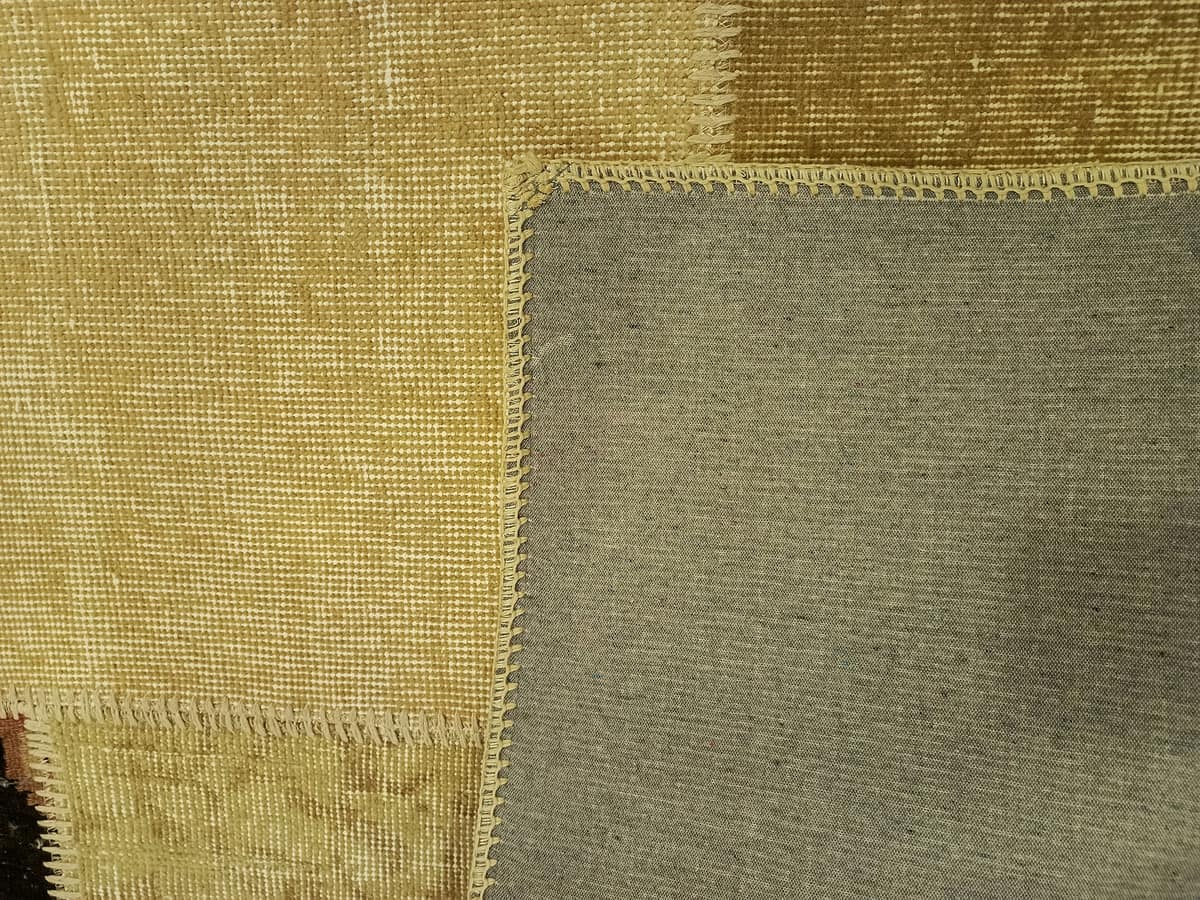 Anatolian-Patterned Distressed Patchwork Rug — detail view 2, handmade vintage rug